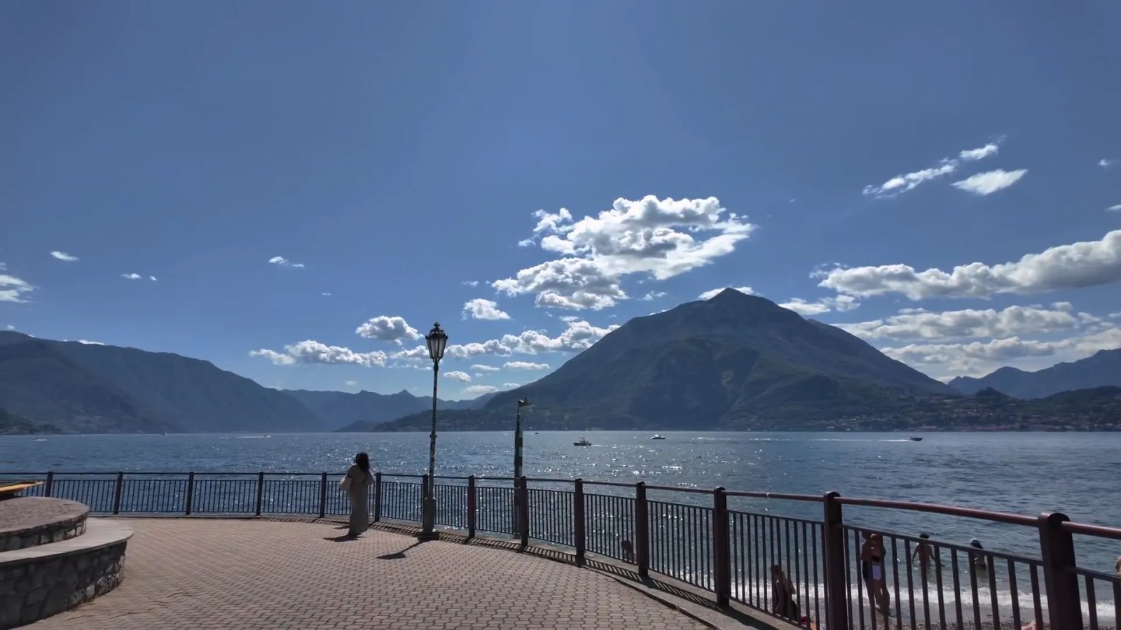 Serene View Of Lake Como And Mountains From A Promenade