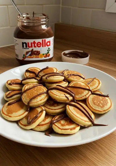 🥞 Fluffy Mini Pancakes (Bite-Sized Goodness!) ✨  These adorable, fluffy mini pancakes are perfect for breakfast, snacking, or stacking into a fun pancake cereal! 🍯  📋 Ingredients: ✅ 1 cup (125g) all-purpose flour 🌾  ✅ 2 tbsp sugar 🍚  ✅ 1 tsp baking powder