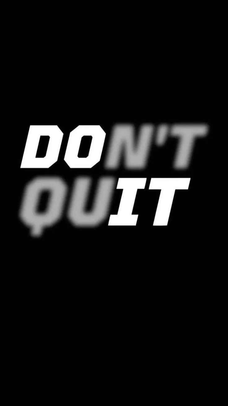 the words don't quit in white on a black background