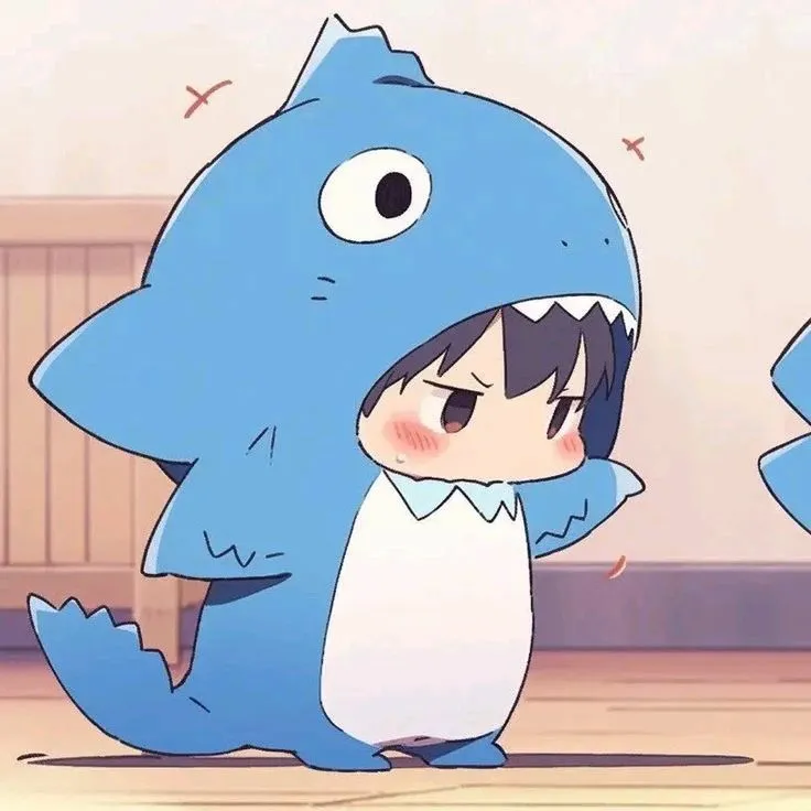 an animated image of a blue shark with its mouth open and eyes wide open, sitting on the floor