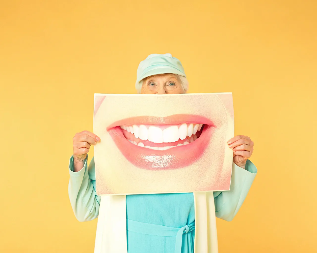 Take a photo of an old lady holding a large...