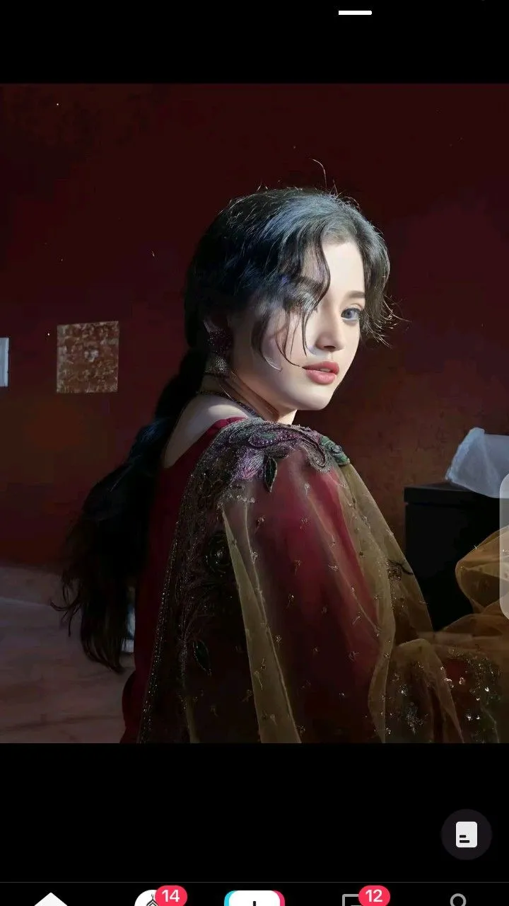 an image of a woman with makeup on her face and long hair, wearing a red dress