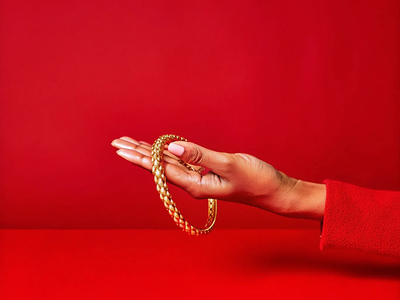 golden bracelet on a hand
