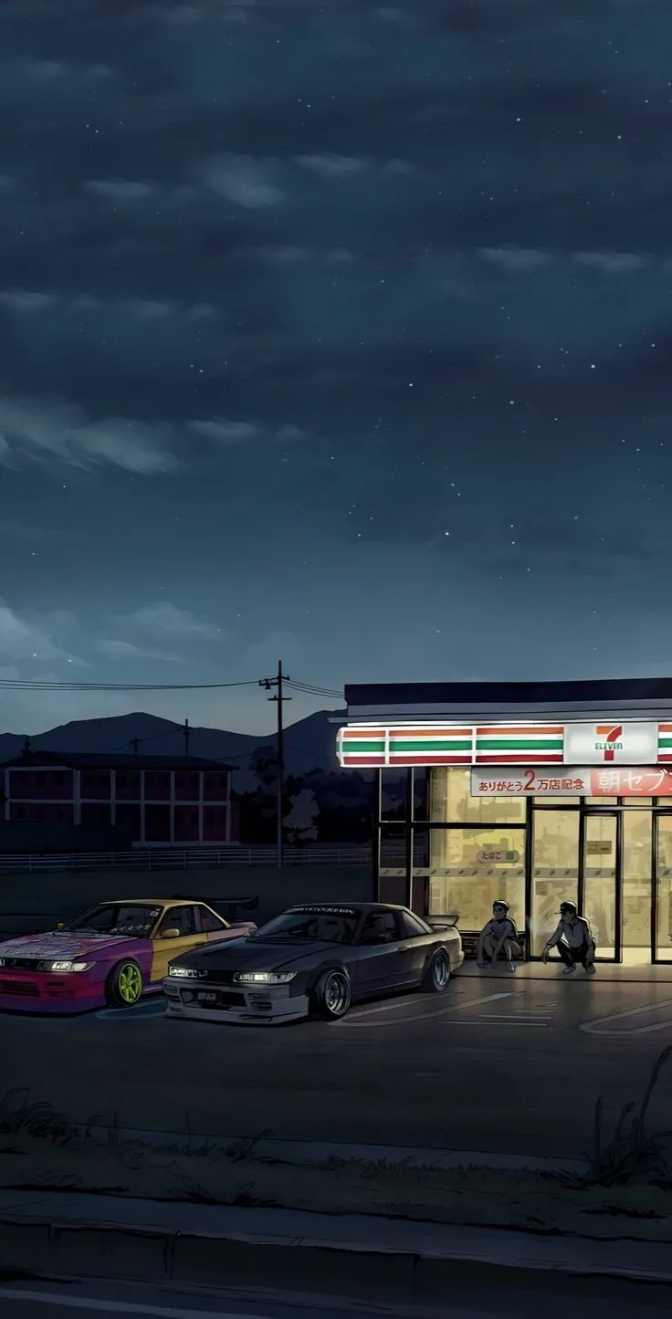 cars parked in front of a gas station at night