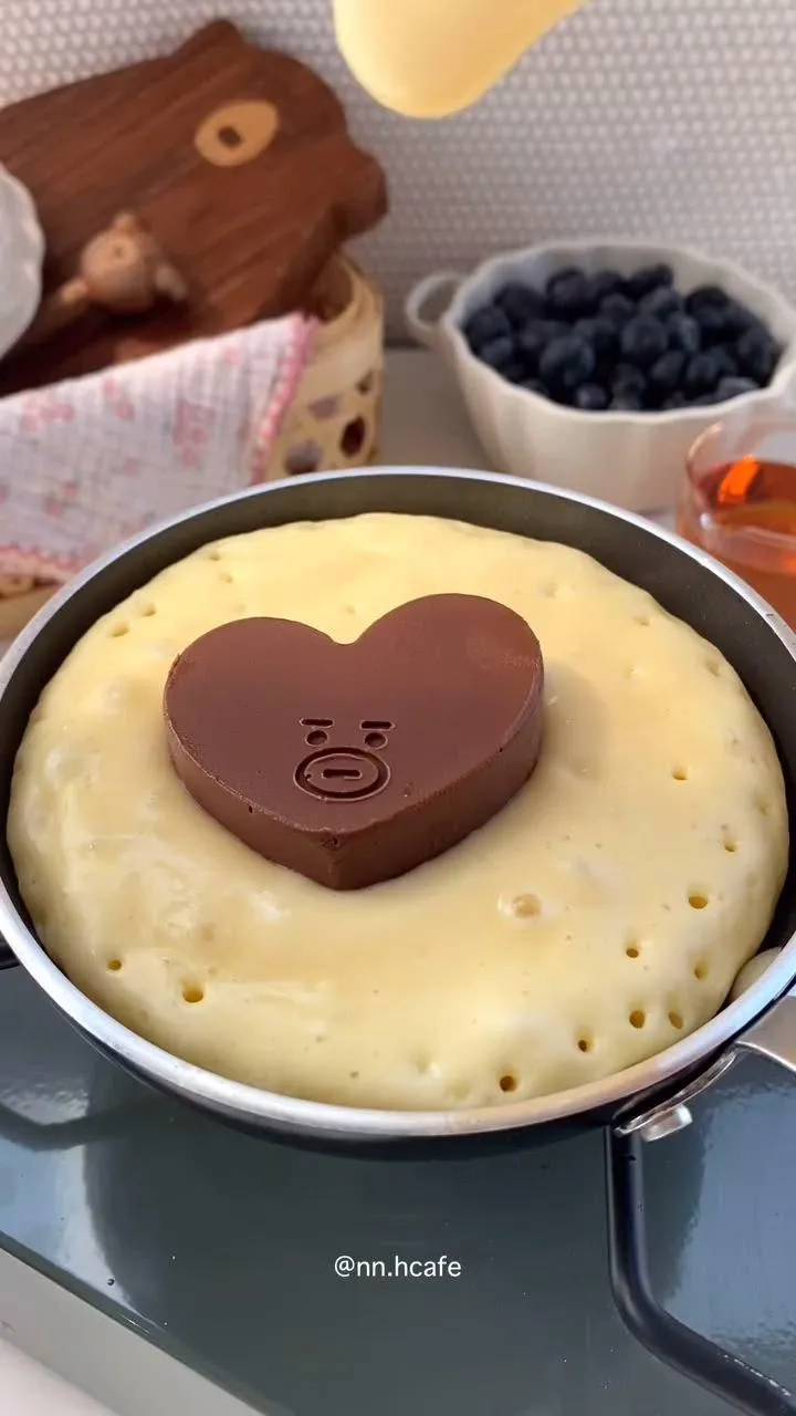 Indulge in the ultimate treat with these fluffy pancakes filled with ooey-gooey chocolate goodness! Perfect for a cozy brunch or dessert delight.