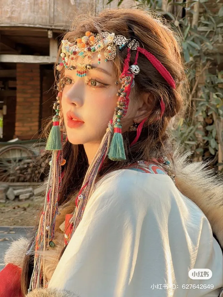 a woman with long hair and jewelry on her head