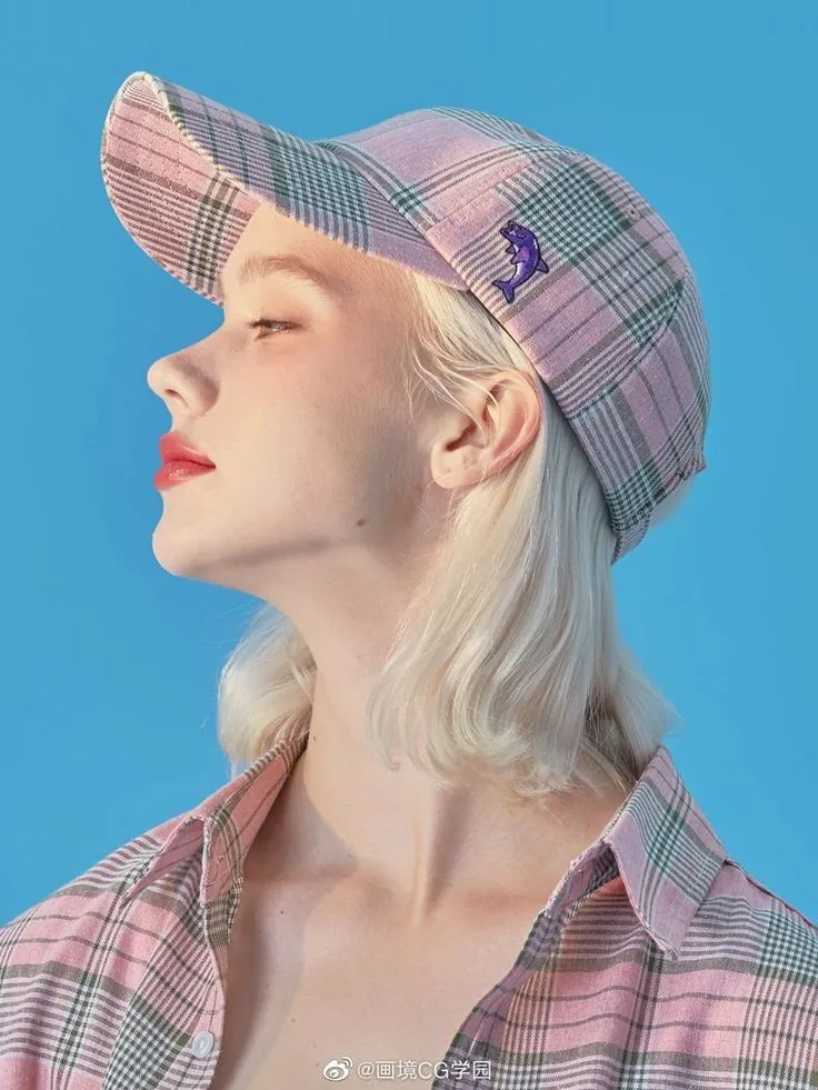 a woman with blonde hair wearing a pink plaid hat and looking off to the side