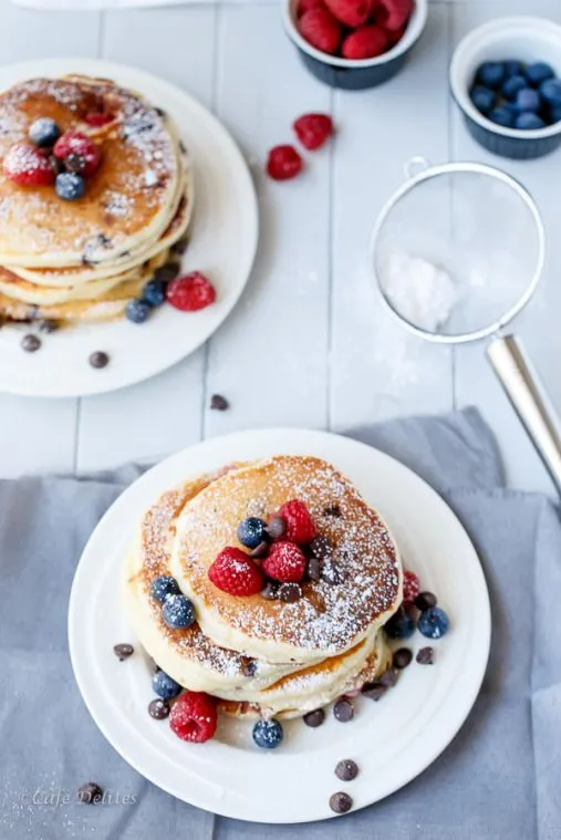 Fluffy Greek Yoghurt Mixed Berry Choc Chip Pancakes | http://cafedelites.com
