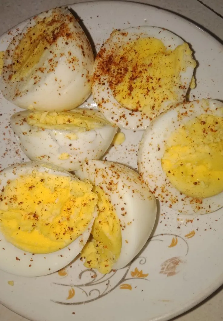 an egg is cut in half on a plate