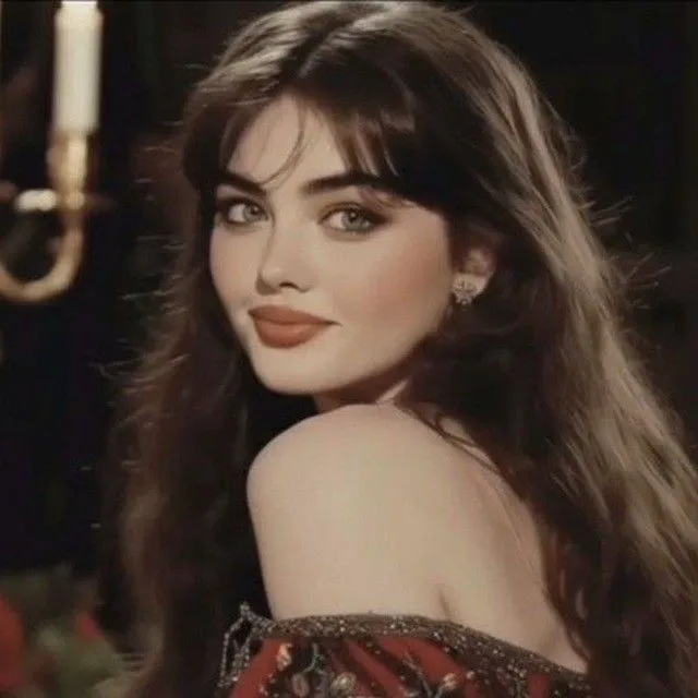 a woman with long hair wearing a red dress