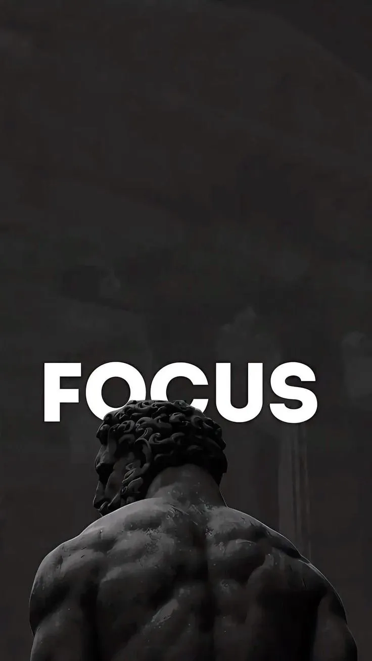 a black and white photo with the words focus on it's side, in front of a statue