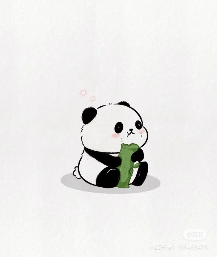 a panda bear sitting on the ground holding a green object