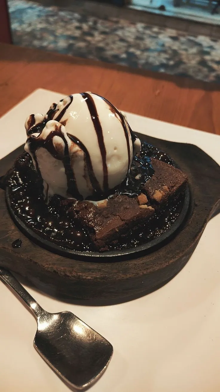 a chocolate dessert with ice cream on top