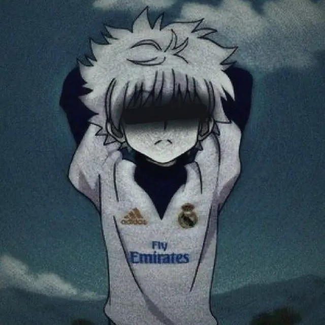 an animated image of a boy with his head in his hands, wearing a real madrid jersey