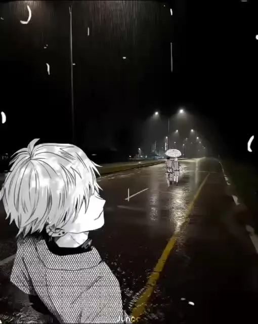 a person standing in the middle of a street at night with an umbrella over their head