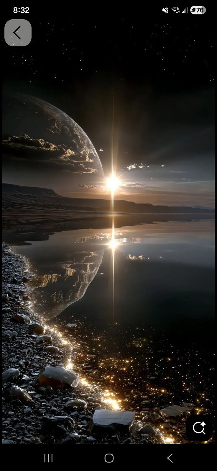 an image of the sun rising over water and land with rocks in front of it