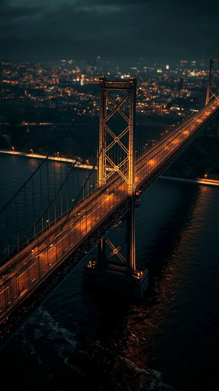 an aerial view of the golden gate bridge in san francisco, california at night time