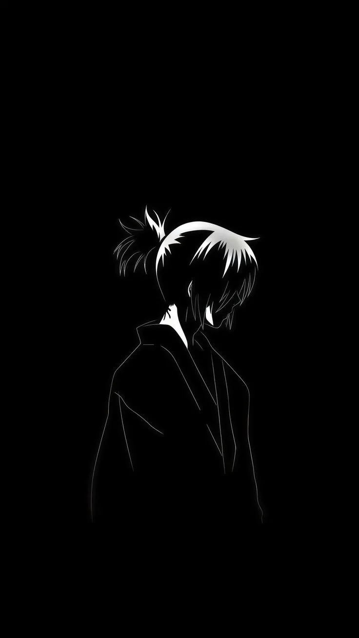 a black and white photo of a person with short hair in the dark, wearing a suit