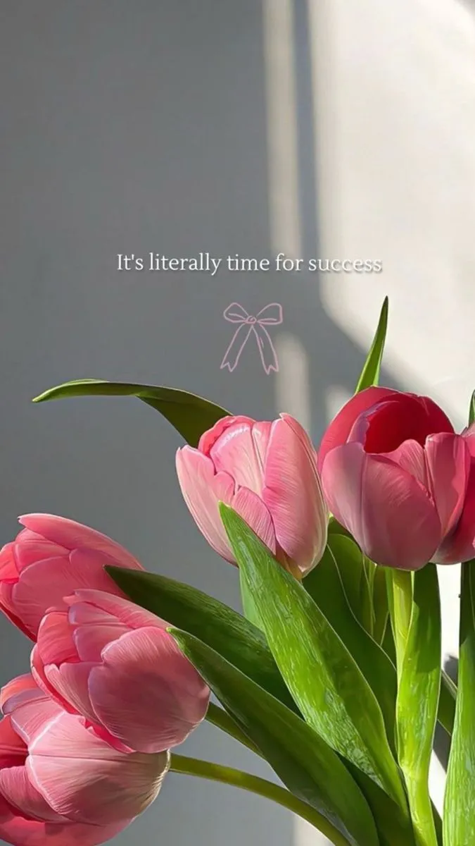 pink tulips in a vase with the words it's literally time for success