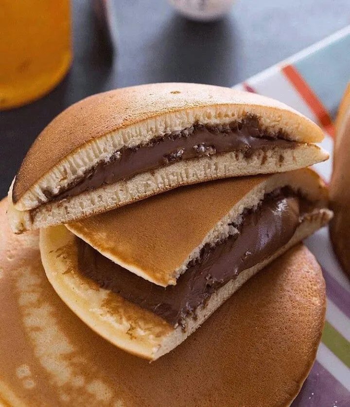 a stack of pancakes sitting on top of a table