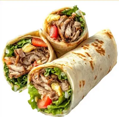 three burritos with meat, lettuce and tomatoes on them are cut in half